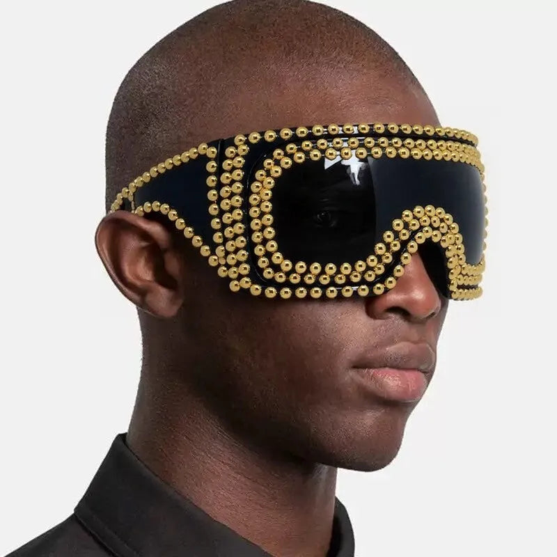 Men's punk-style sunglasses with large square silver frames and prominent rivet details.