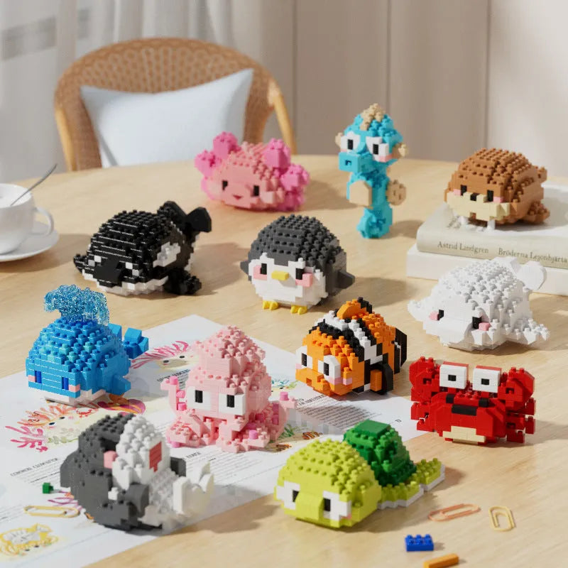 Twelve marine small creature building block models in a colour box including turtle, blue whale, and clownfish.