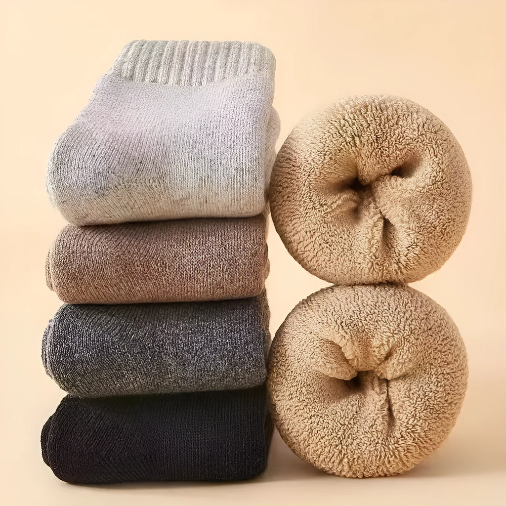 Two pairs of thick midsole Merino wool socks in a solid colour, presented inside a gift box.