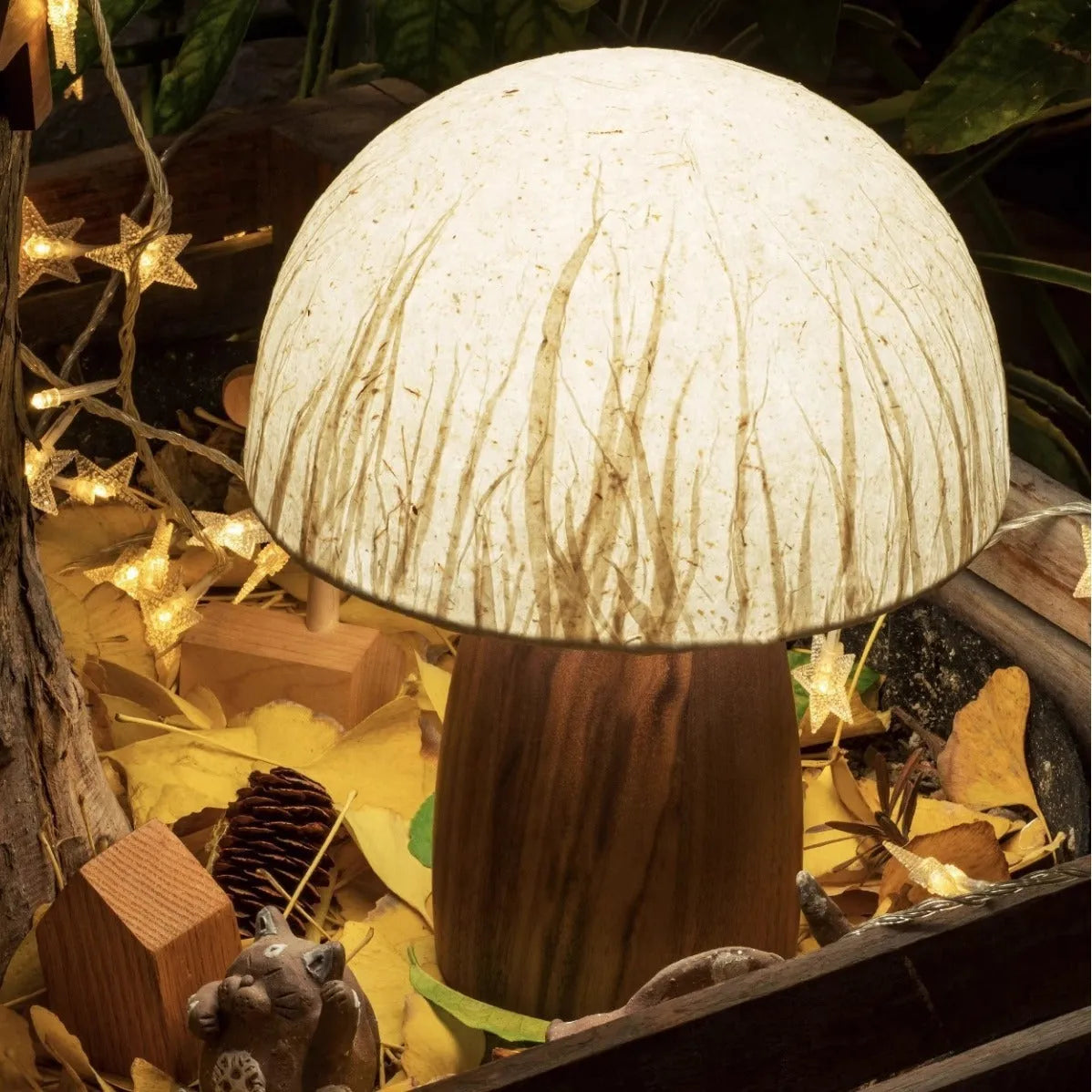 Handmade black walnut mushroom lamp with Japanese style ambient glow on tabletop