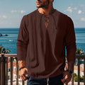 Cotton blend loose beach ruff shirt in a solid colour on a hanger.