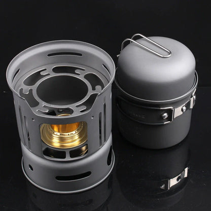 Small black stainless steel camping cookware set with alcohol stove and components