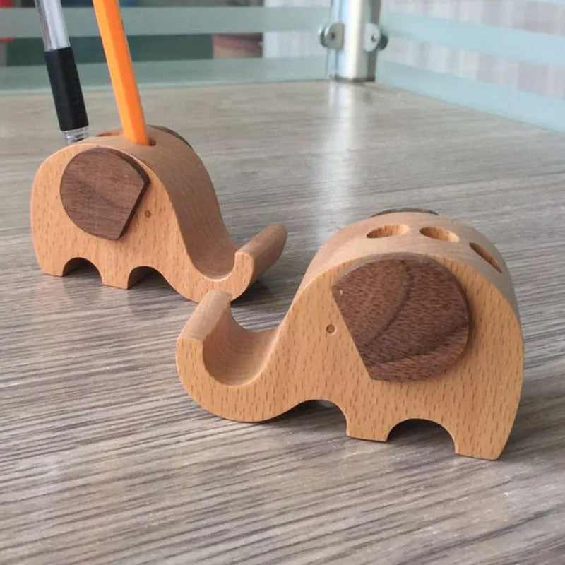 Beech wood and resin lazy phone holder bracket with decorative animal design holding a mobile phone.