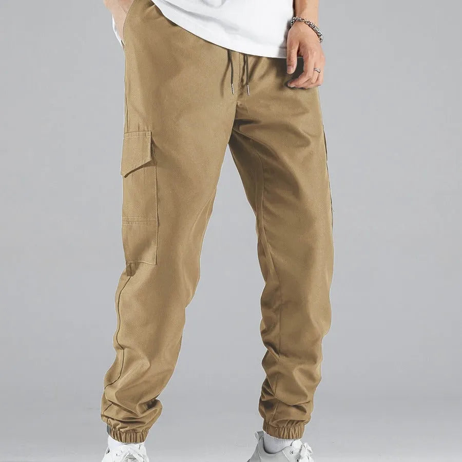 Men's multi-pocket workwear trousers in army green with drawstring waist, side and back pockets, straight leg cut