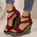 Women's beige wedge sandals with a thick rubber sole and buckle ankle strap on a cloth upper.