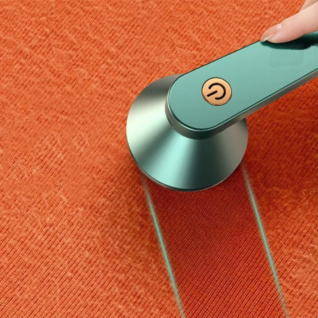 White or green USB rechargeable electric lint remover for clothing with removable lint collector container.