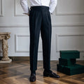 Men's high-waisted straight-leg casual trousers in black polyester fabric on a hanger.
