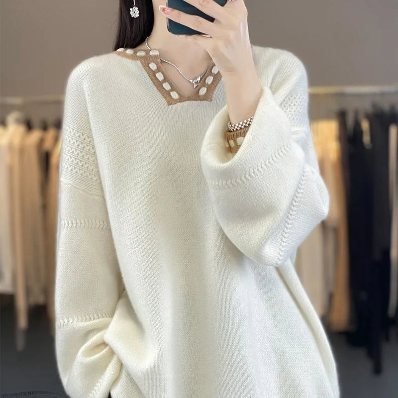 Women's camel V-neck long sleeve viscose pullover sweater on a hanger.