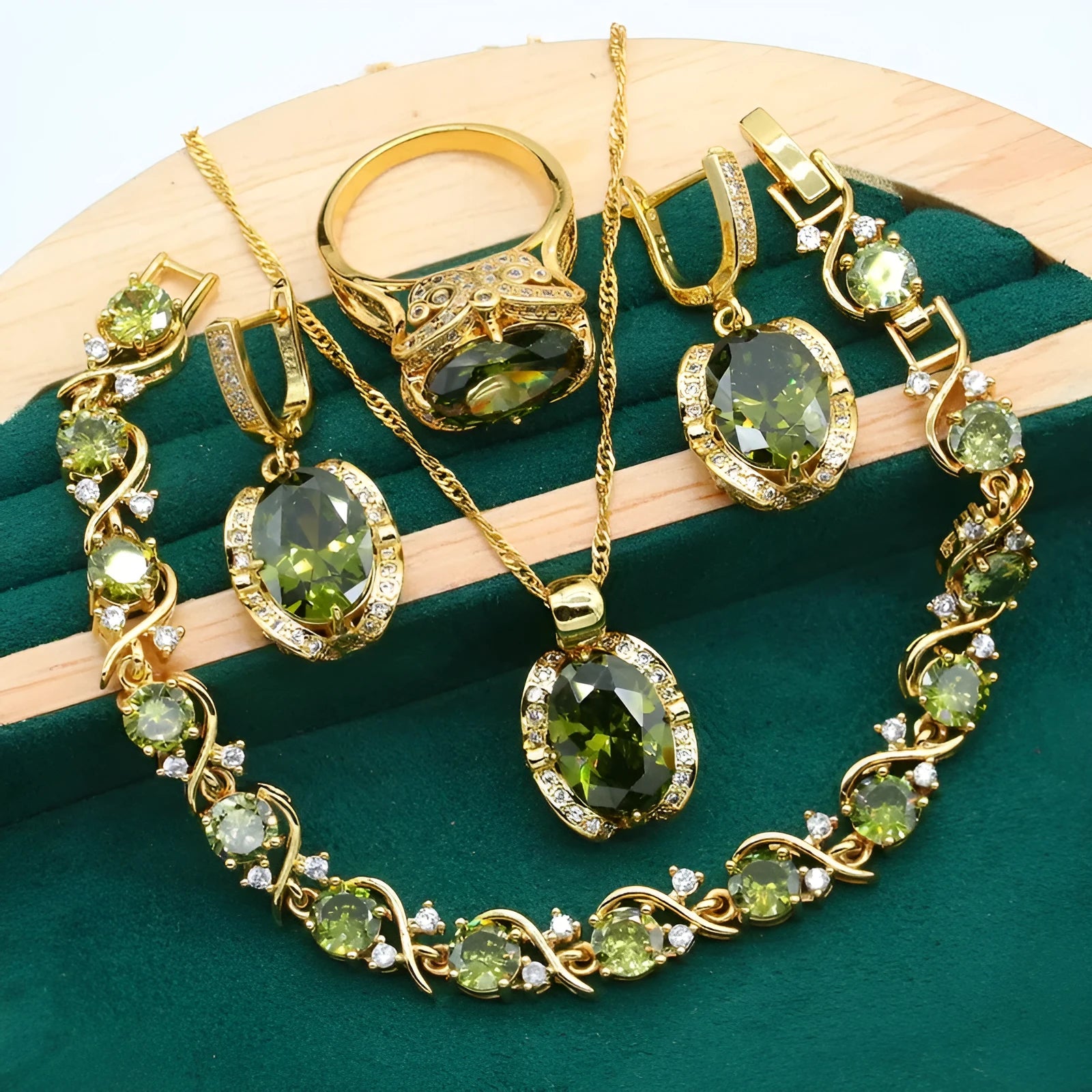 Olive green zircon jewellery suit for women featuring a snake bones chain necklace, matching earrings, and ring with a crown pattern.