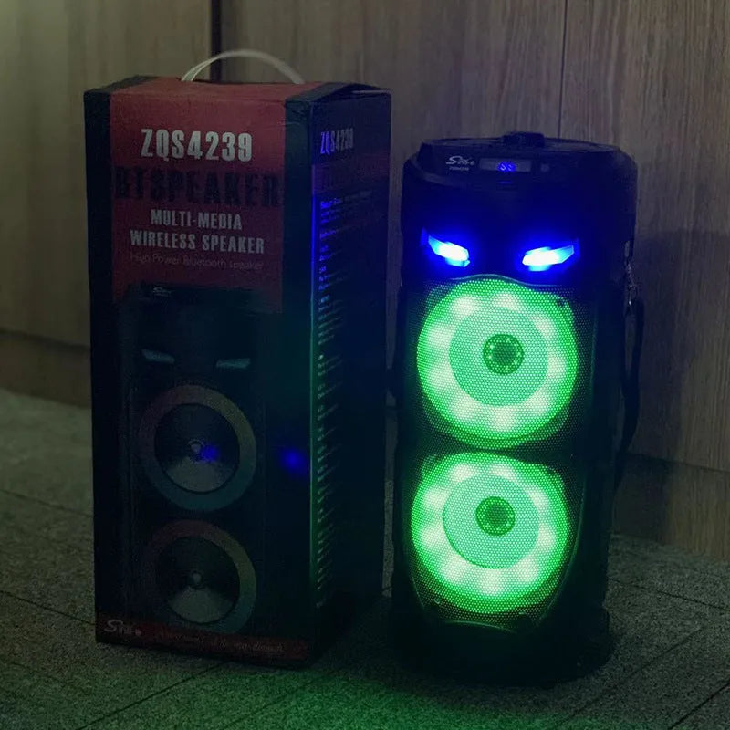 Black portable Bluetooth speaker with dual horn cannon design showing USB charging port and compact dimensions