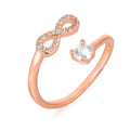 Open geometric ring with an inlaid zircon stone forming a letter, shown in gold, rose gold, and silver finishes.