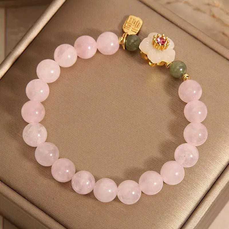Crystal Hetian Jade bracelet with camellia fruit-shaped charms in pastoral style design