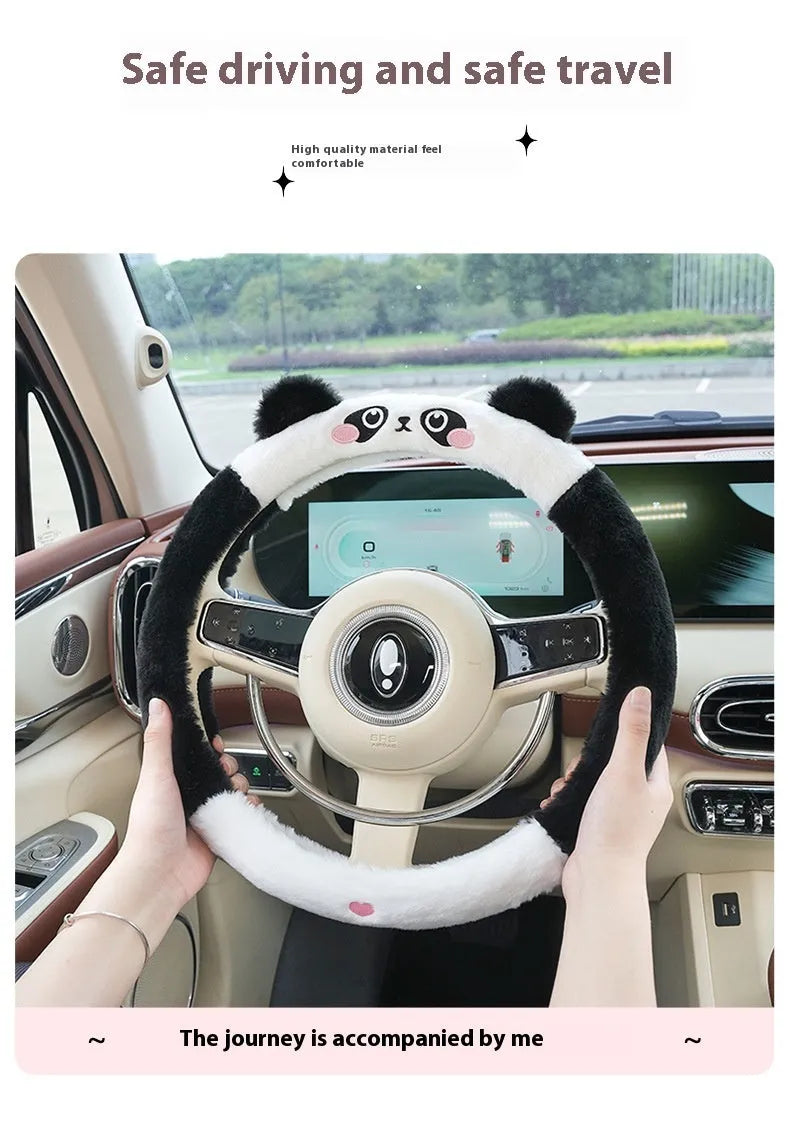 Plush rabbit fur steering wheel cover with embroidered panda design, shown fitted on a car wheel.