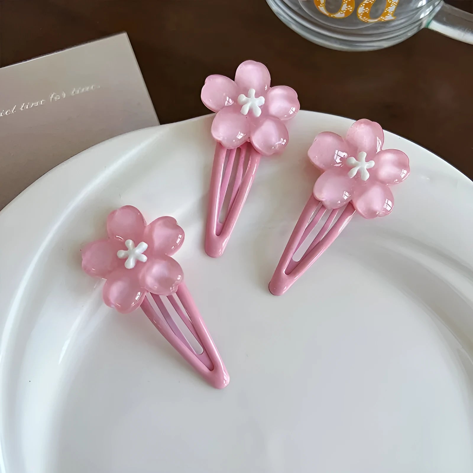 Handmade acrylic cherry blossom hair clip in pink floral design for women