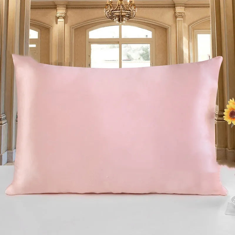 19 M double-sided silk pillowcase shown in one of 14 colours, including apricot, champagne, and navy blue.
