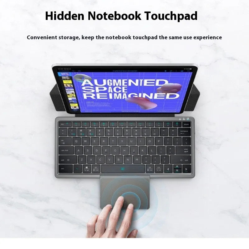 Black and grey wireless Bluetooth keyboard with touchpad next to its leather sheath stand.