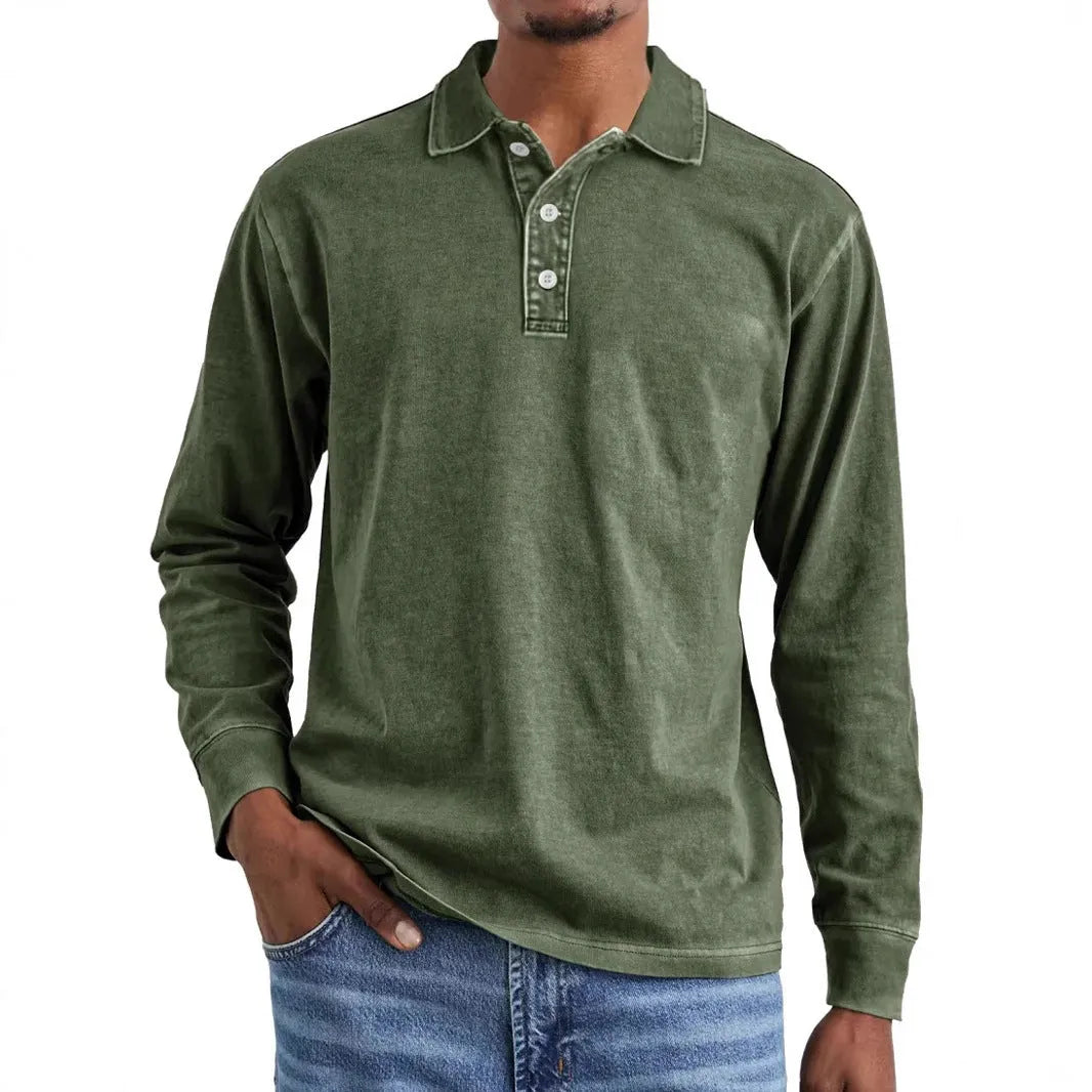 Man wearing a retro washed grey cotton polo shirt with distressed details and a lapel collar.