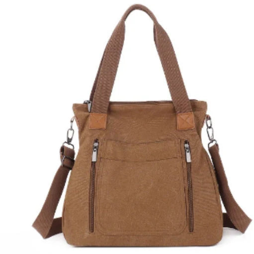 Women's canvas shoulder bag in multiple colours, showcasing spacious interior and zipper closure.