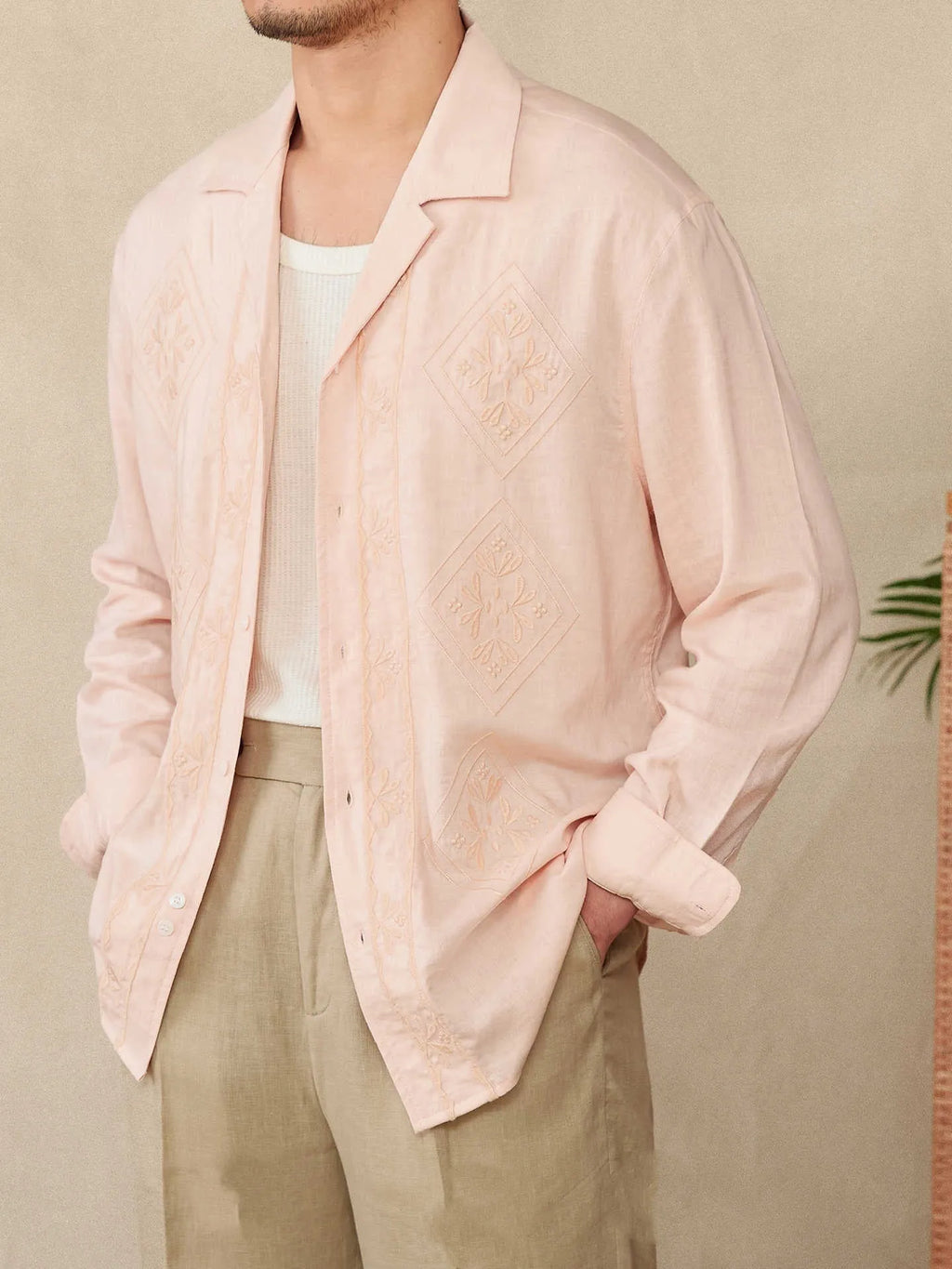 Cotton and linen thin embroidery Cuban collar long sleeve sunscreen shirt in white on a plain background