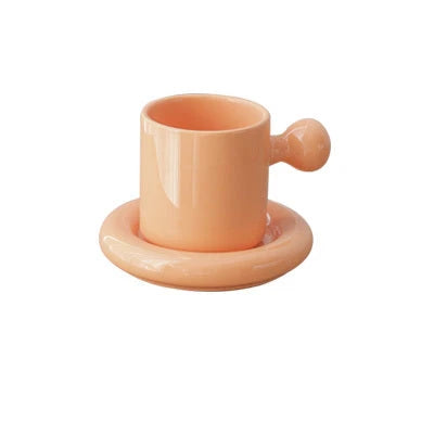 Creative Vitality Egg Yolk Cup Mug and Saucer Set in vibrant coconut milk-white, egg yellow, coral orange, and honeydew green colours