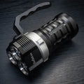 Aluminium alloy diving flashlight showing 18cm length, displayed with optional battery charger kit.