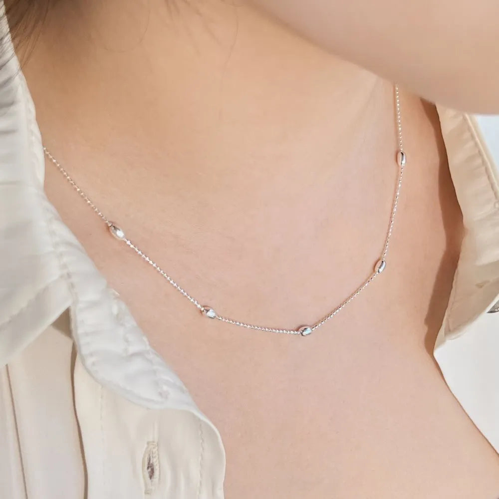 Women's 925 silver oval bead clavicle chain, simple electroplated finish, silver colour necklace on display