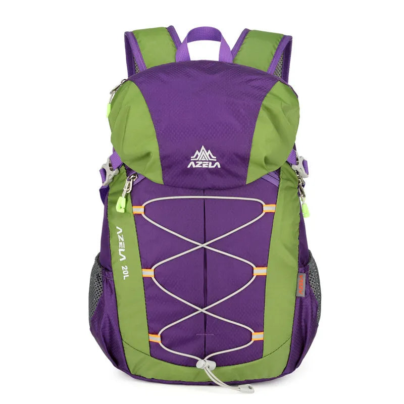 AZELA 20L Color Block Lightweight Hiking Backpack in orange and black, front view, on a rocky outdoor surface