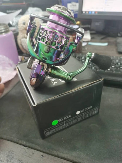 All-metal spinning fishing reel with stainless steel bearings for saltwater use, showing interchangeable handle