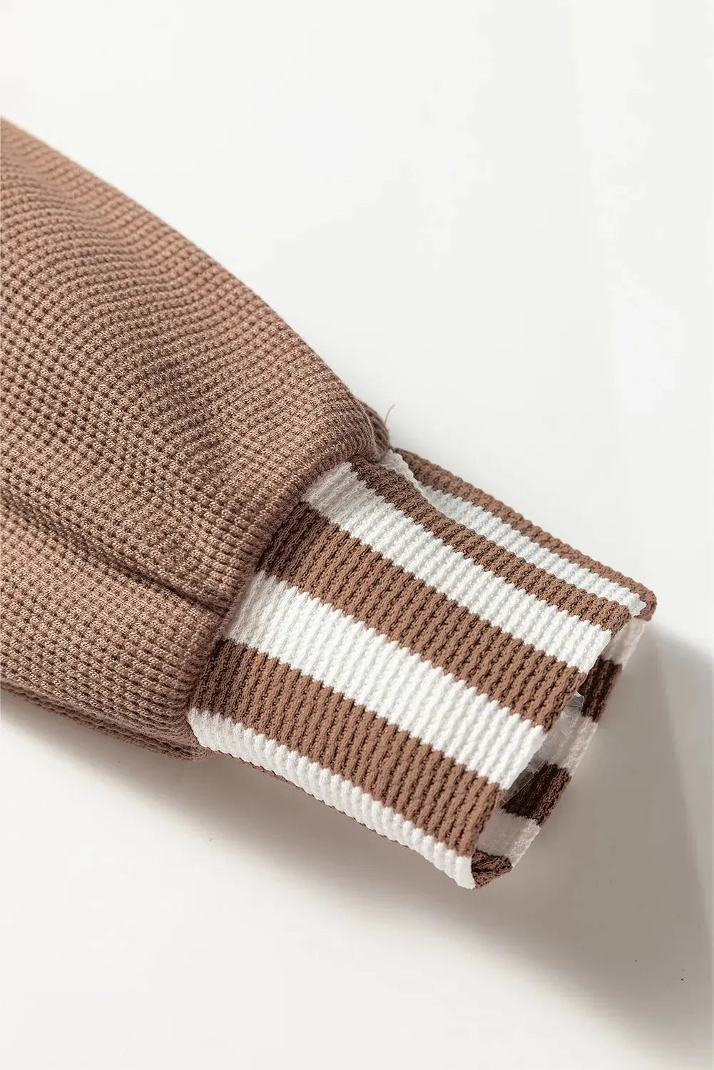 Straw yellow waffle texture hoodie with striped patchwork and a button-front drawstring neckline.