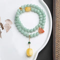 Double-layer women's bracelet with emerald jade round beads and beeswax barrel beads in geometric design