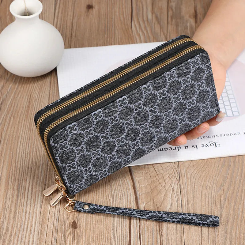 Long black PU leather wallet clutch with print detail showing mobile phone compartment and coin purse
