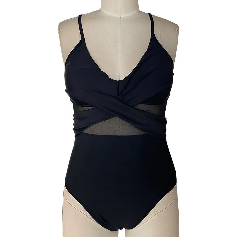 Women's mesh spliced backless one-piece swimsuit in solid black colour, polyester lined