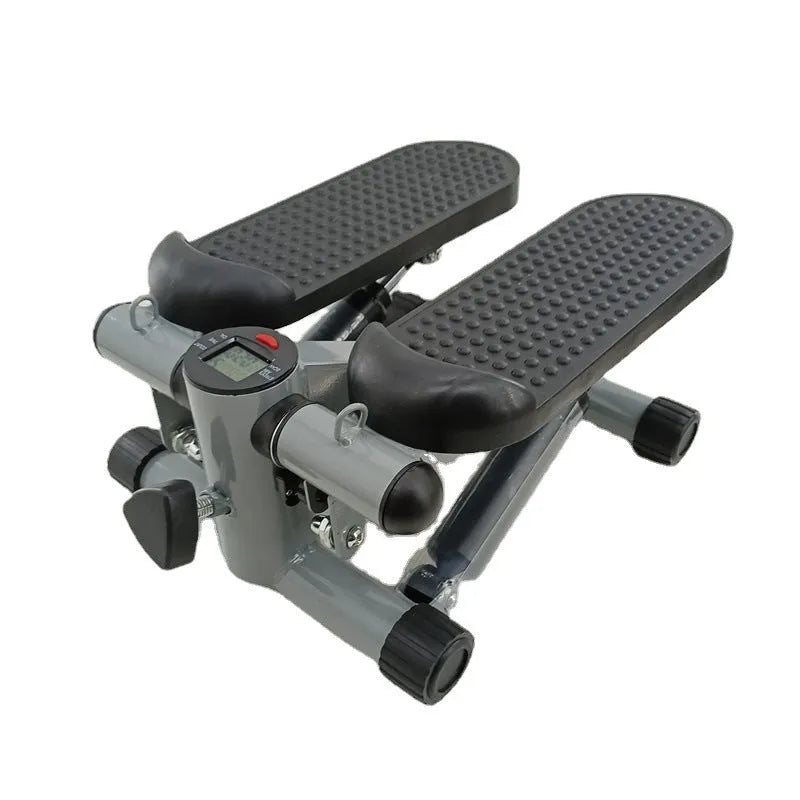 Silver grey hydraulic mini treadmill for waist slimming exercises in a home setting.