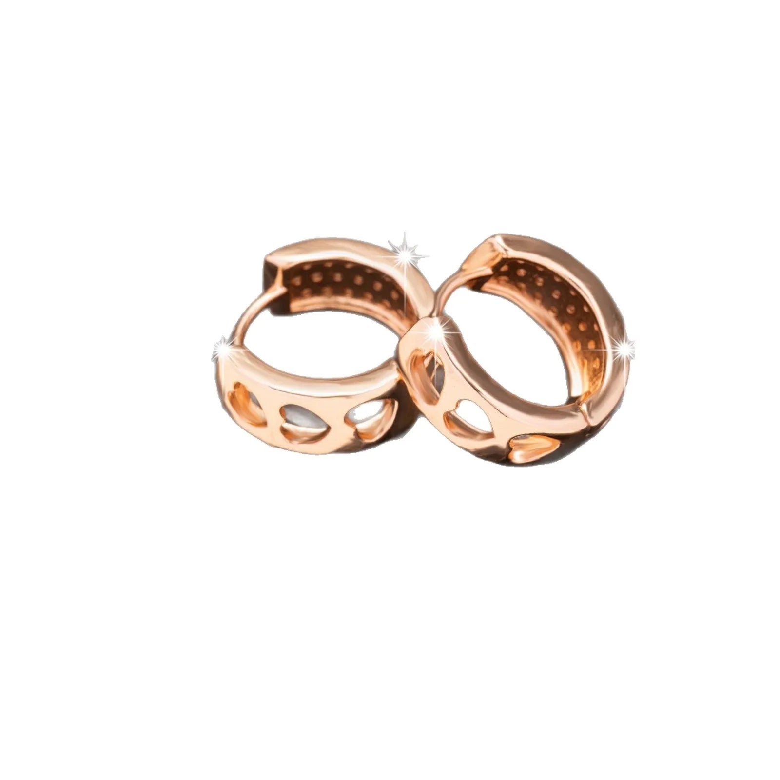 Rose gold women's earrings with a hollowed out heart shape and circular frame.