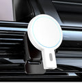 White magnetic wireless phone charger on desk with phone charging