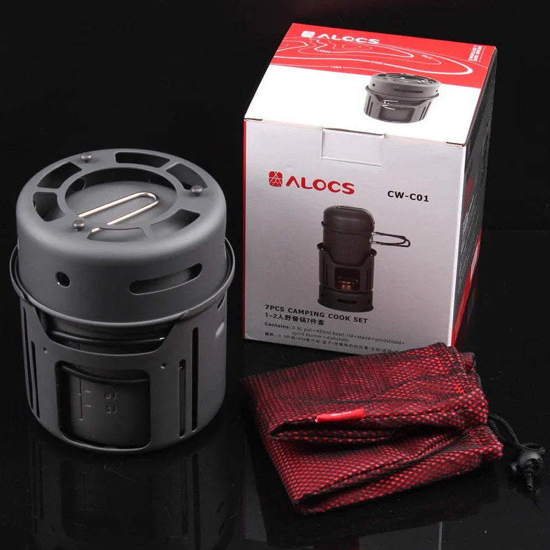 Small black stainless steel camping cookware set with alcohol stove and components