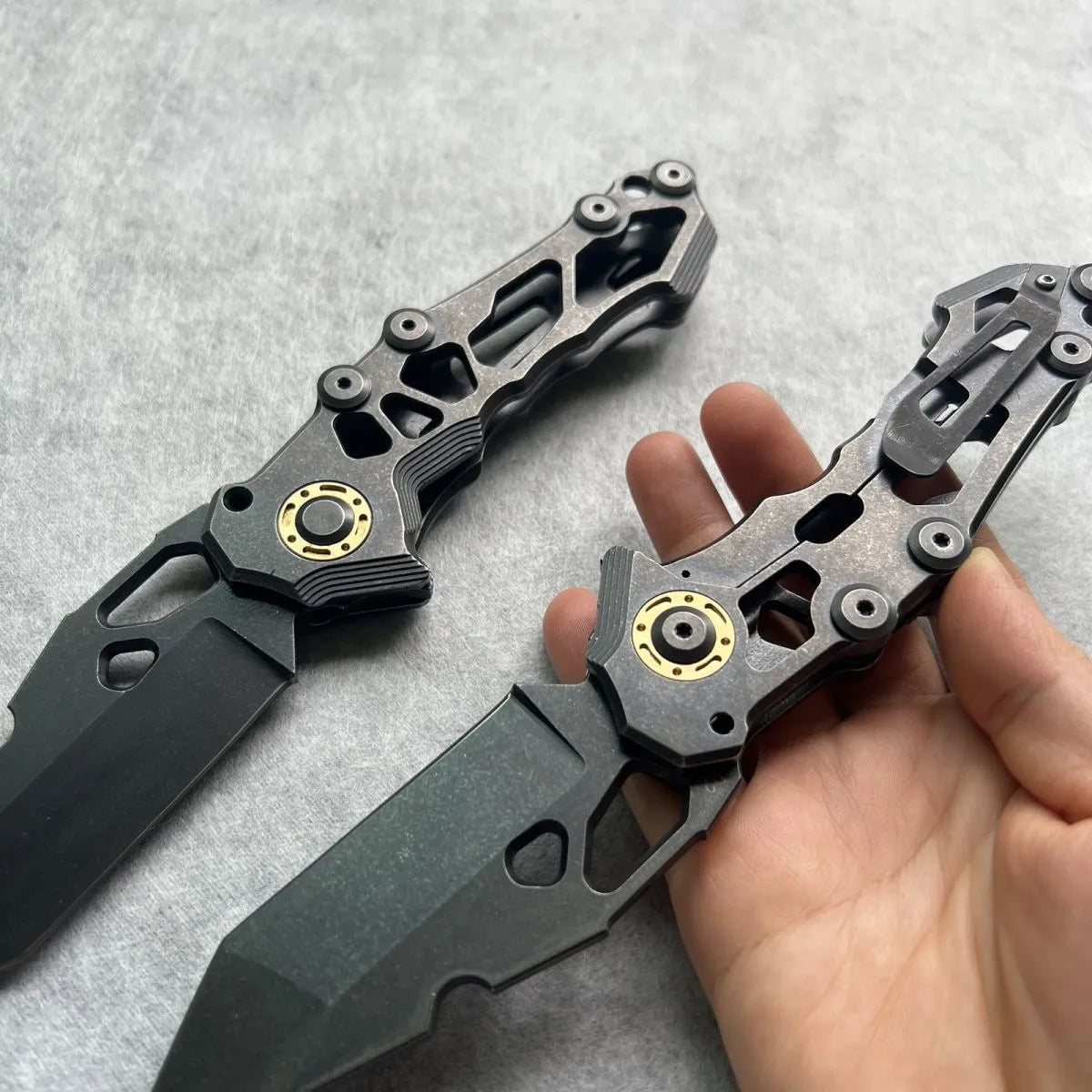 D2 steel folding knife with 9cm blade on outdoor background