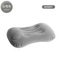 Grey flocking finish portable press inflatable travel pillow for neck support, shown deflated and inflated.