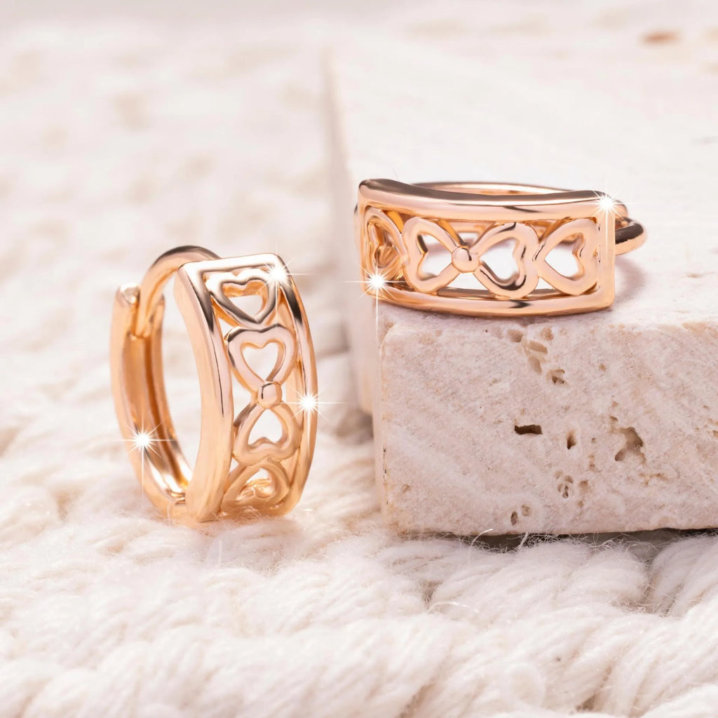 Love Glossy Hollow Ear Clip in rose gold copper electroplated earrings on display
