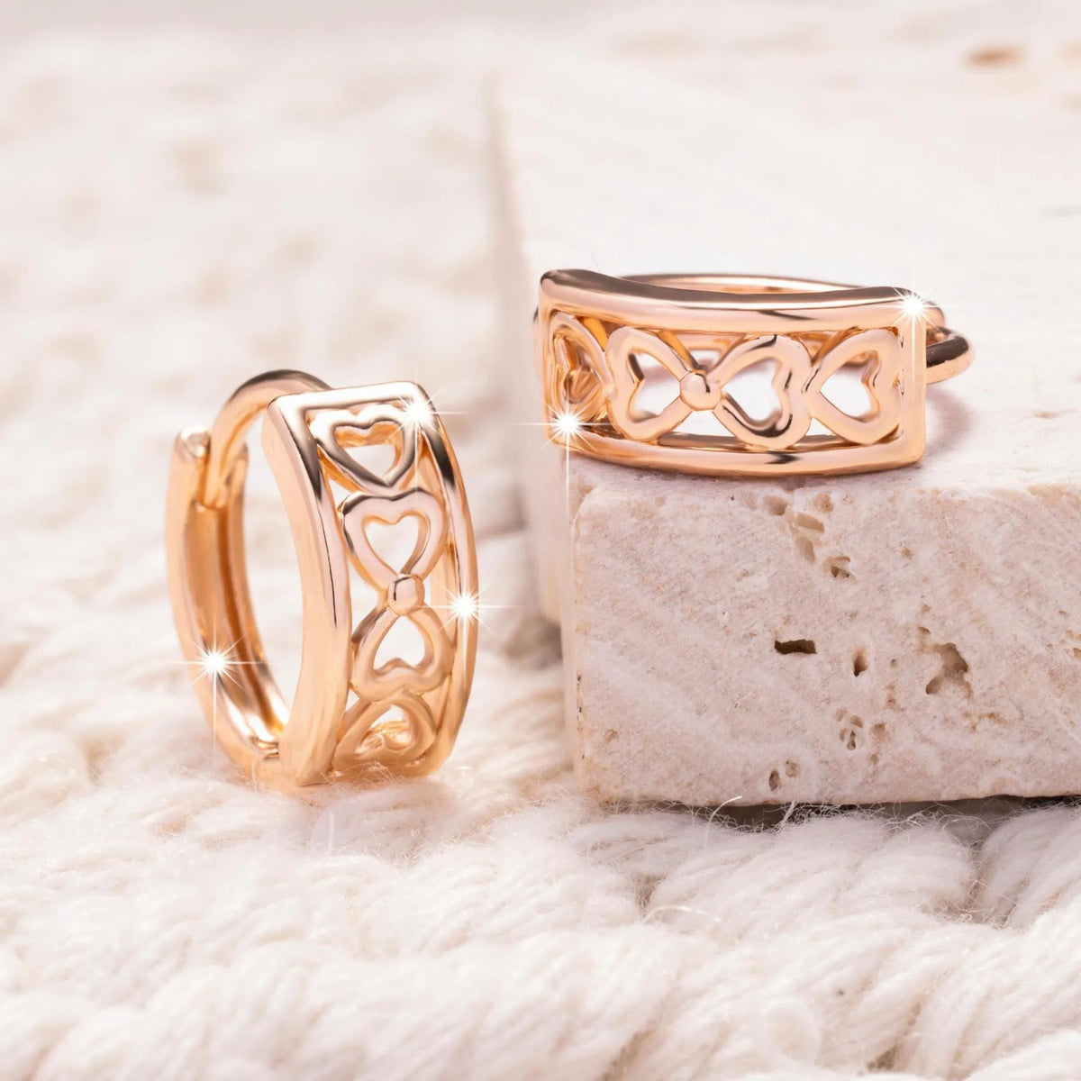 Love Glossy Hollow Ear Clip in rose gold copper electroplated earrings on display