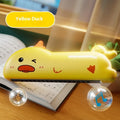 Cartoon plastic whistle musical instrument for children, green dinosaur colour, on white background