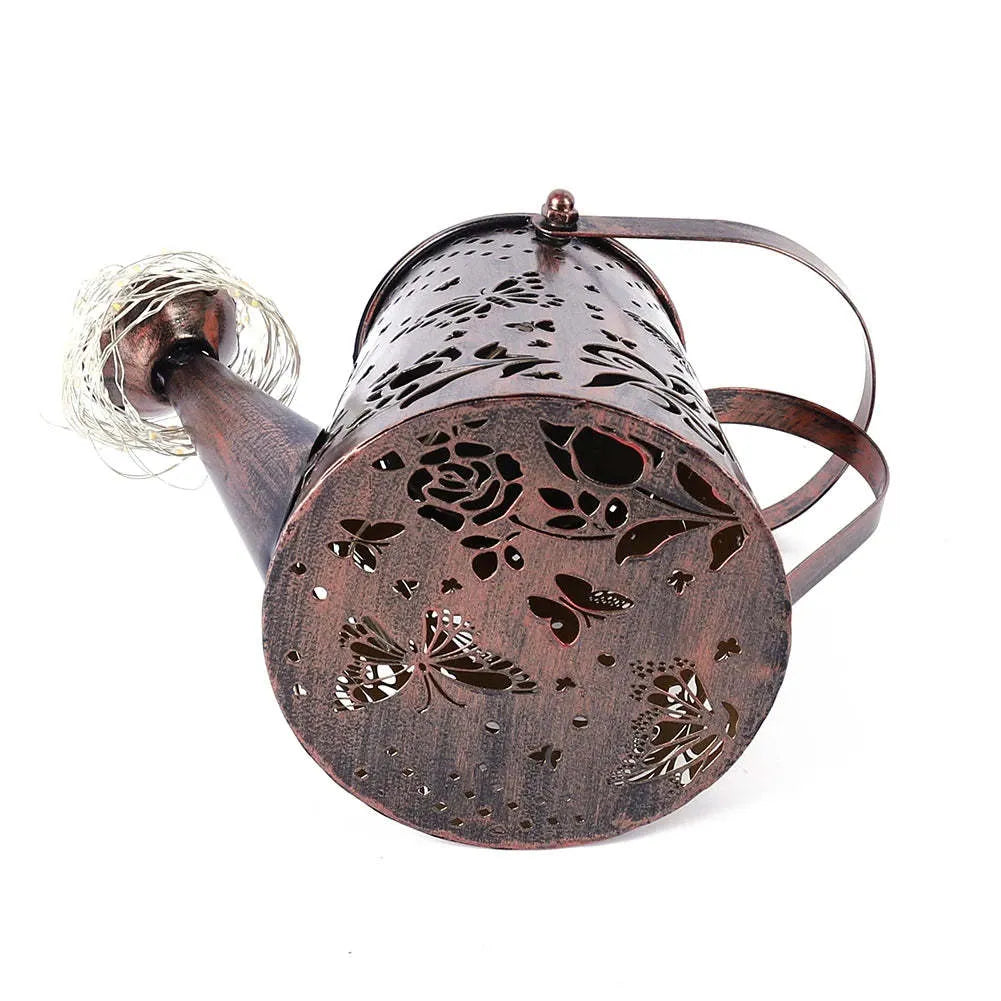 Iron solar garden lamp with pastoral butterfly pattern and warm white LED light.