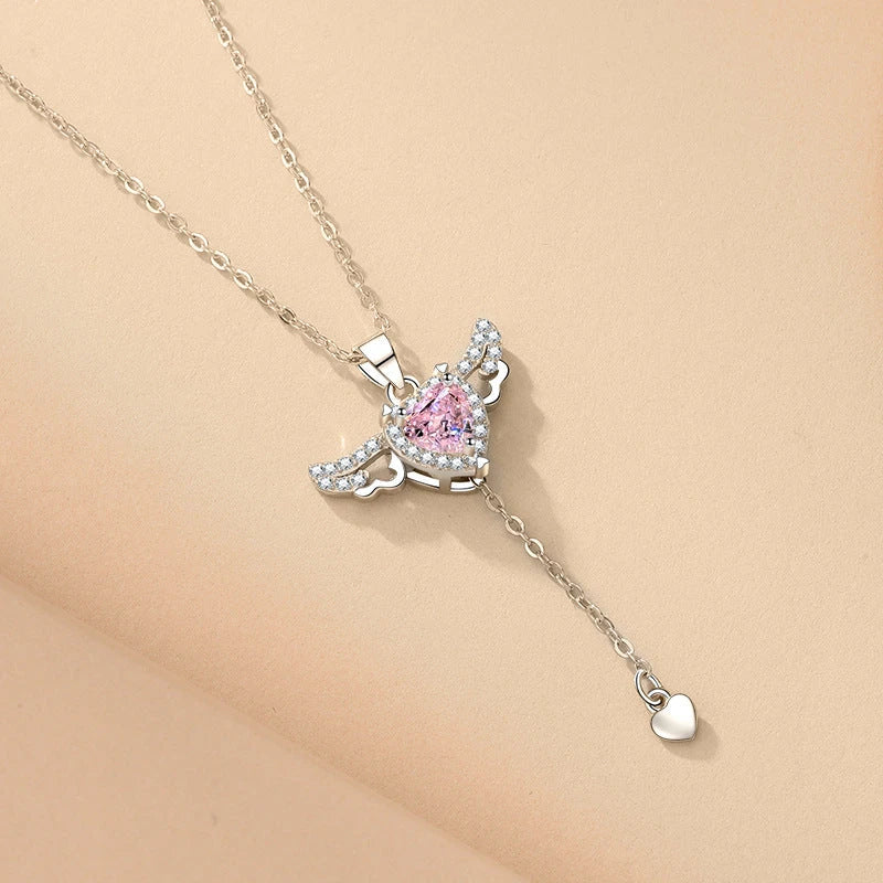 Sparkling Cupid heart necklace with fluttering angel wings, made of titanium steel and zircon crystals