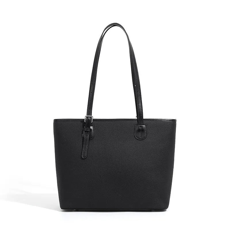 Genuine leather women's tote bag in retro square style with internal organiser pockets.