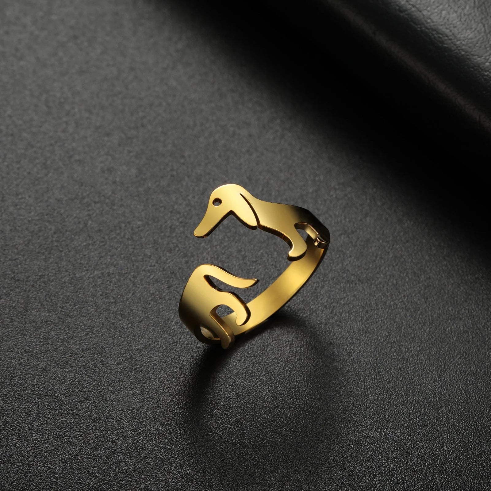 Adjustable titanium steel sausage dog ring in steel and gold finishes