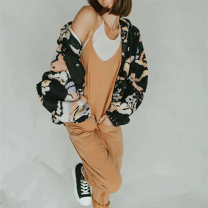 Women's sleeveless polyester jumpsuit with zipper and patch pockets in various colours