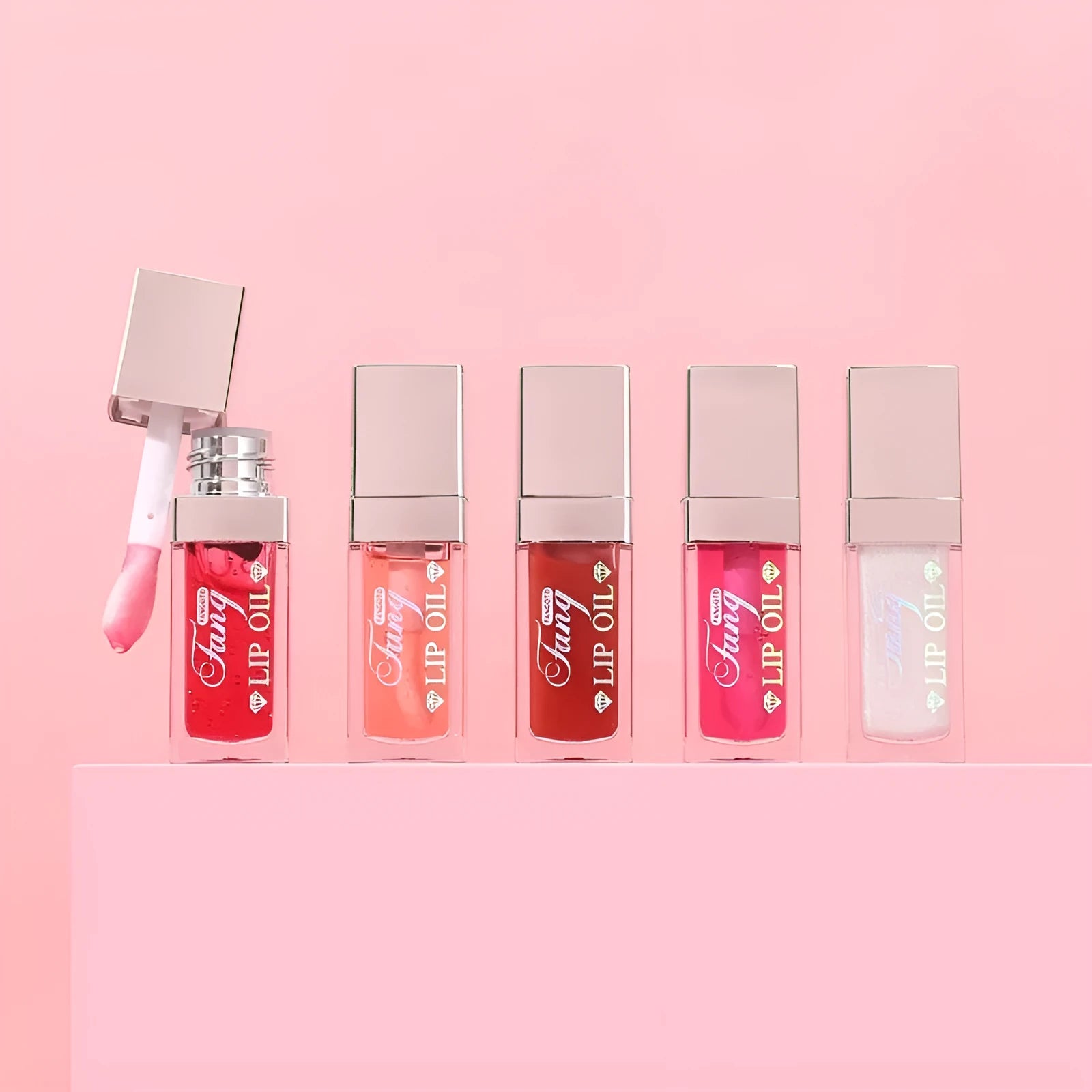 Five bright coloured mint lip gloss tubes showing shades Style001, Style006, Style007, Style012 and Style015