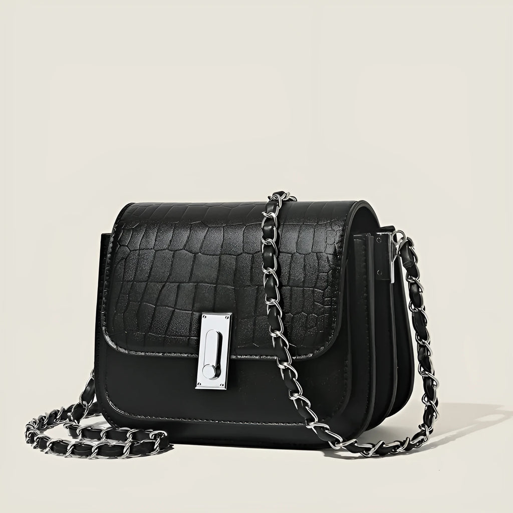 Soft black PU women's chain shoulder bag with sewing thread detail and a phone pocket.