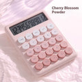Desktop calculator with gradient colour finish in violet, blue, mint, or pink on a desk.