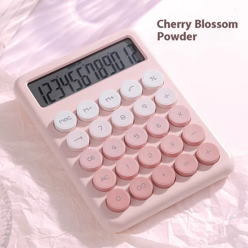 Desktop calculator with gradient colour finish in violet, blue, mint, or pink on a desk.